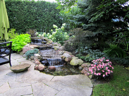 pondless waterfall next to Crazy Quilt limestone patio