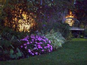 Wall wash lighting increases a garden's evening ambience.
