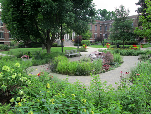 The paver walkway winds around the garden, inviting exploration. Photo taken summer of 2012.