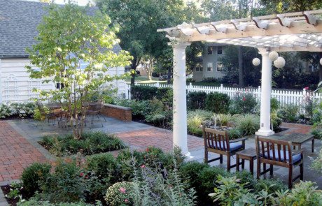outdoor living rooms with lush plantings, pergola, furniture