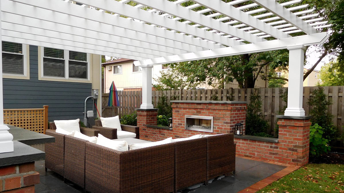 Fireplace and pergola create outdoor retreat