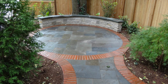 oval bluestone and brick edge patio and walk, mortared limestone wall - Nature's Perspective Landscaping