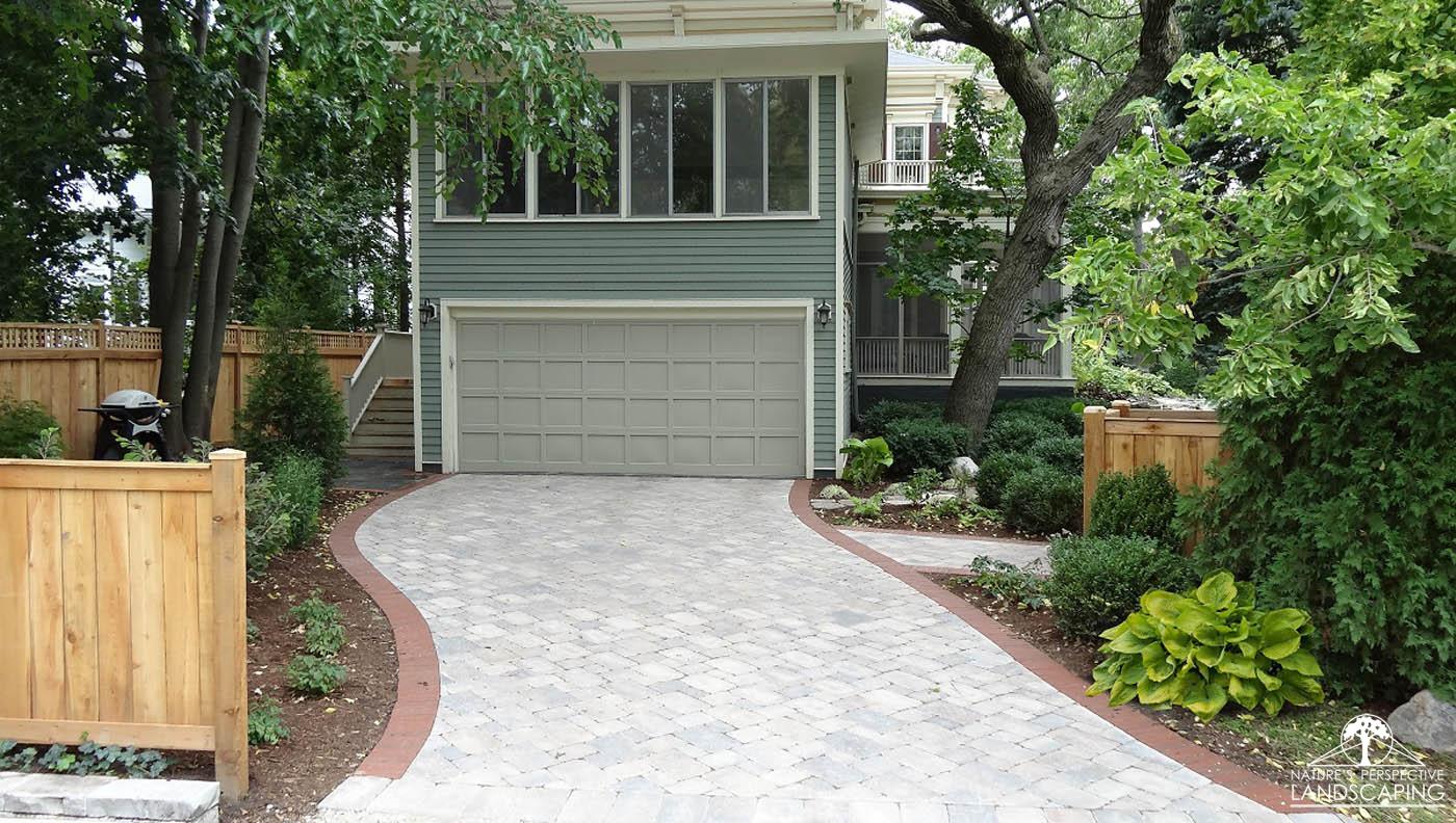 curved Brussels Block and clay paver edge driveway - Nature's Perspective Landscaping