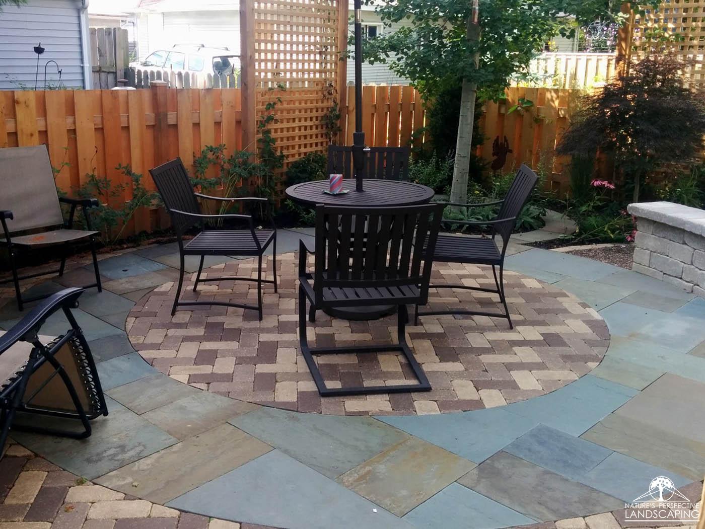 circular bluestone and clay patio and edge- Nature's Perspective Landscaping