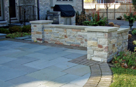mortared stone seatwall and pillars