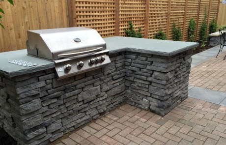 A built-in Rivercrest modular concrete grill, with an L-shape for additional counter space.