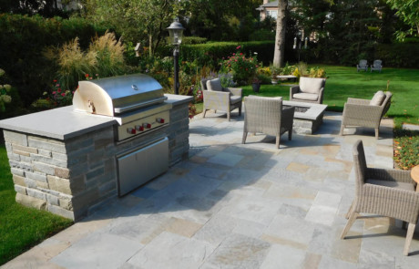 built-in grill with modern bluestone patio and firepit