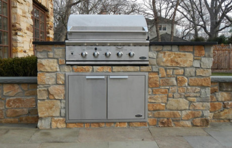 built-in grill with mortared stone and seatwalls