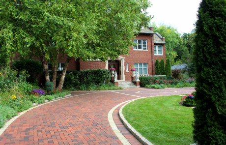 Clay paver driveway to a grand estate
