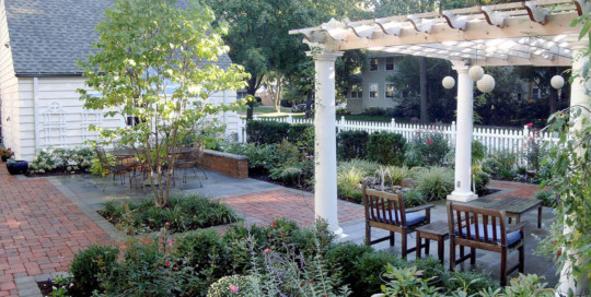 outdoor rooms with lush plantings and pergola-Nature's Perspective Landscaping