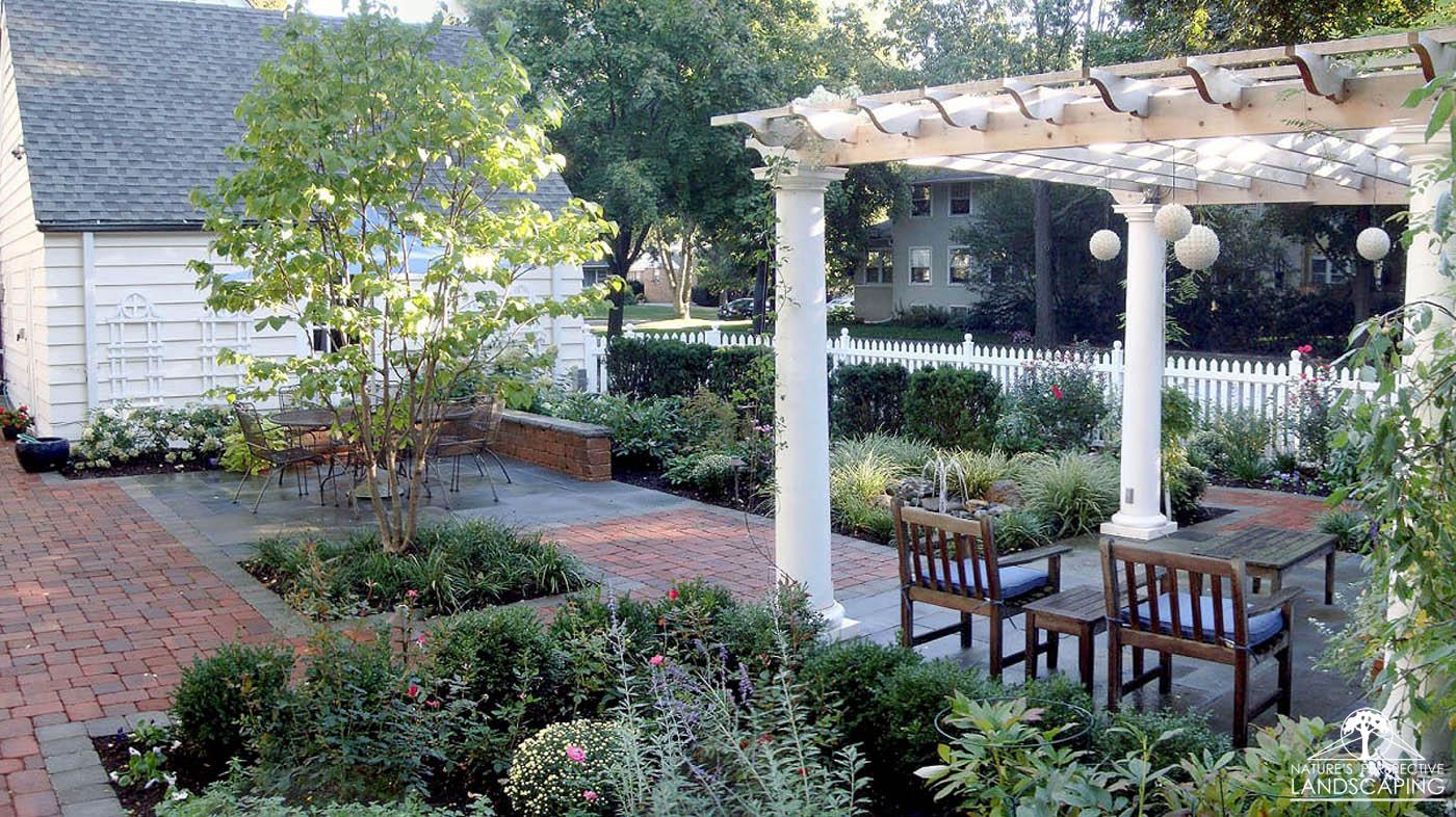 outdoor rooms with lush plantings and pergola-Nature's Perspective Landscaping