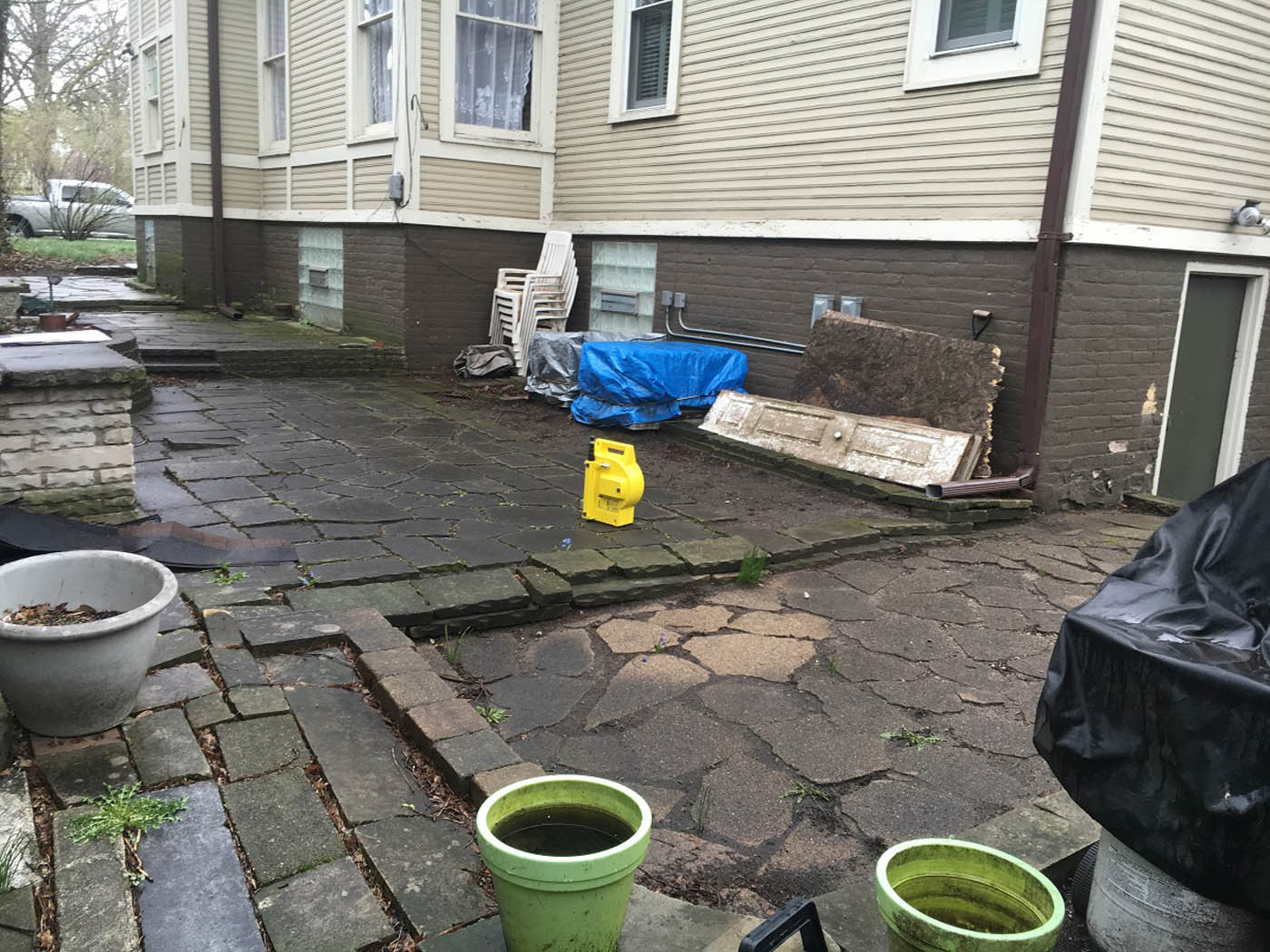 beforefountain-spray-clay-paver-driveway-Nature's Perspective Landscaping
