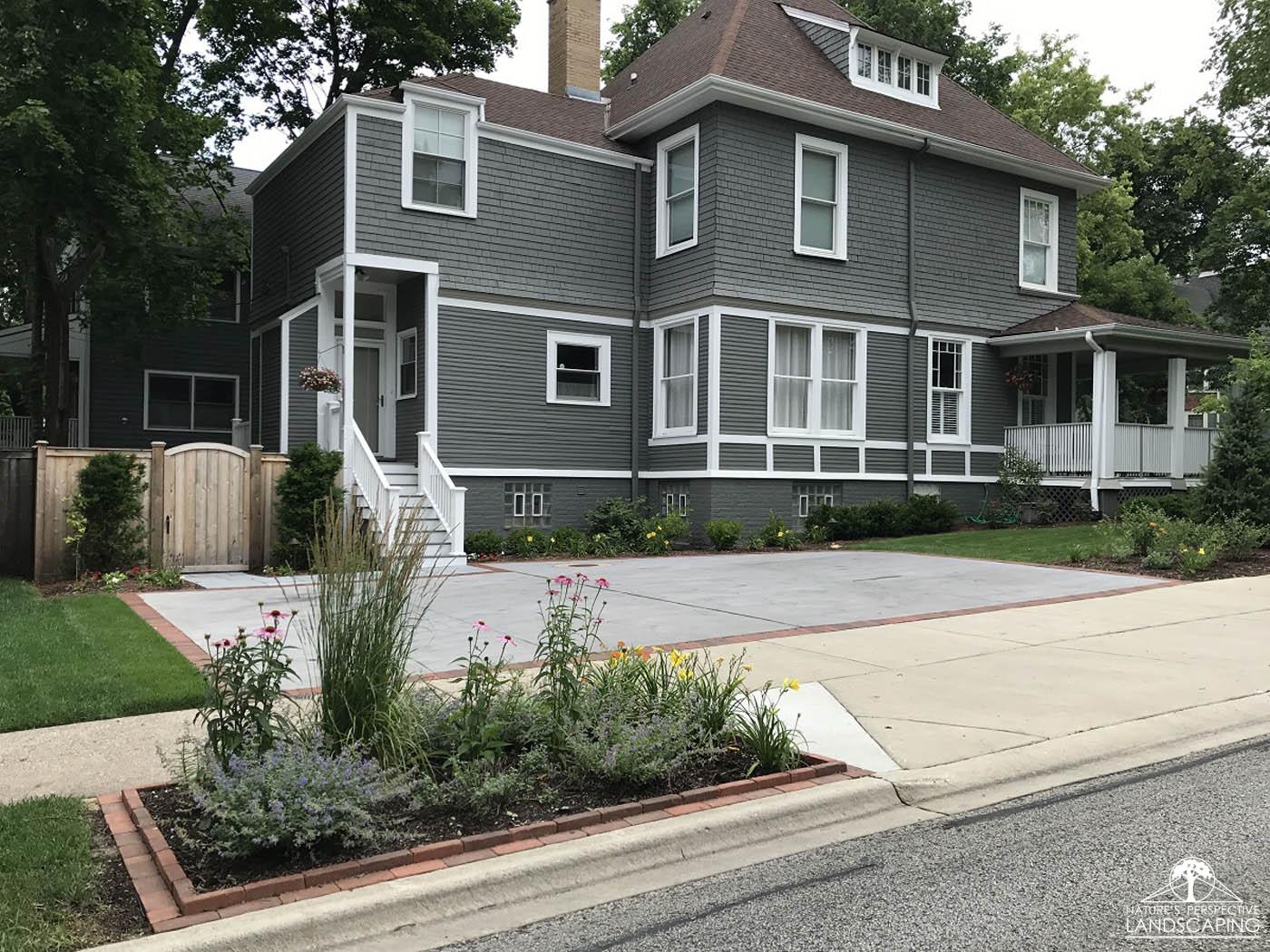 concrete-brick-edge-drivewayfountain-spray-clay-paver-driveway-Nature's Perspective Landscaping