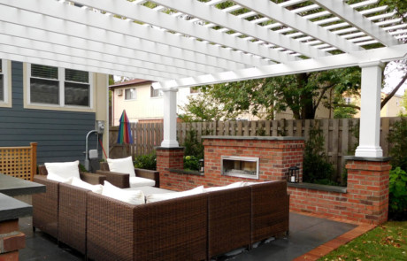 Fireplace and pergola create outdoor retreat