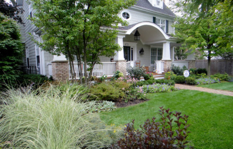Informal front landscape with maiden grasses and weigela
