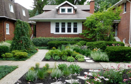 lawn-free front yard with perennials and curb appeal