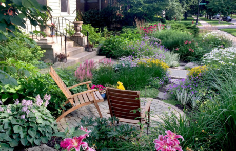 Lawn-free perennial entrance with seating area