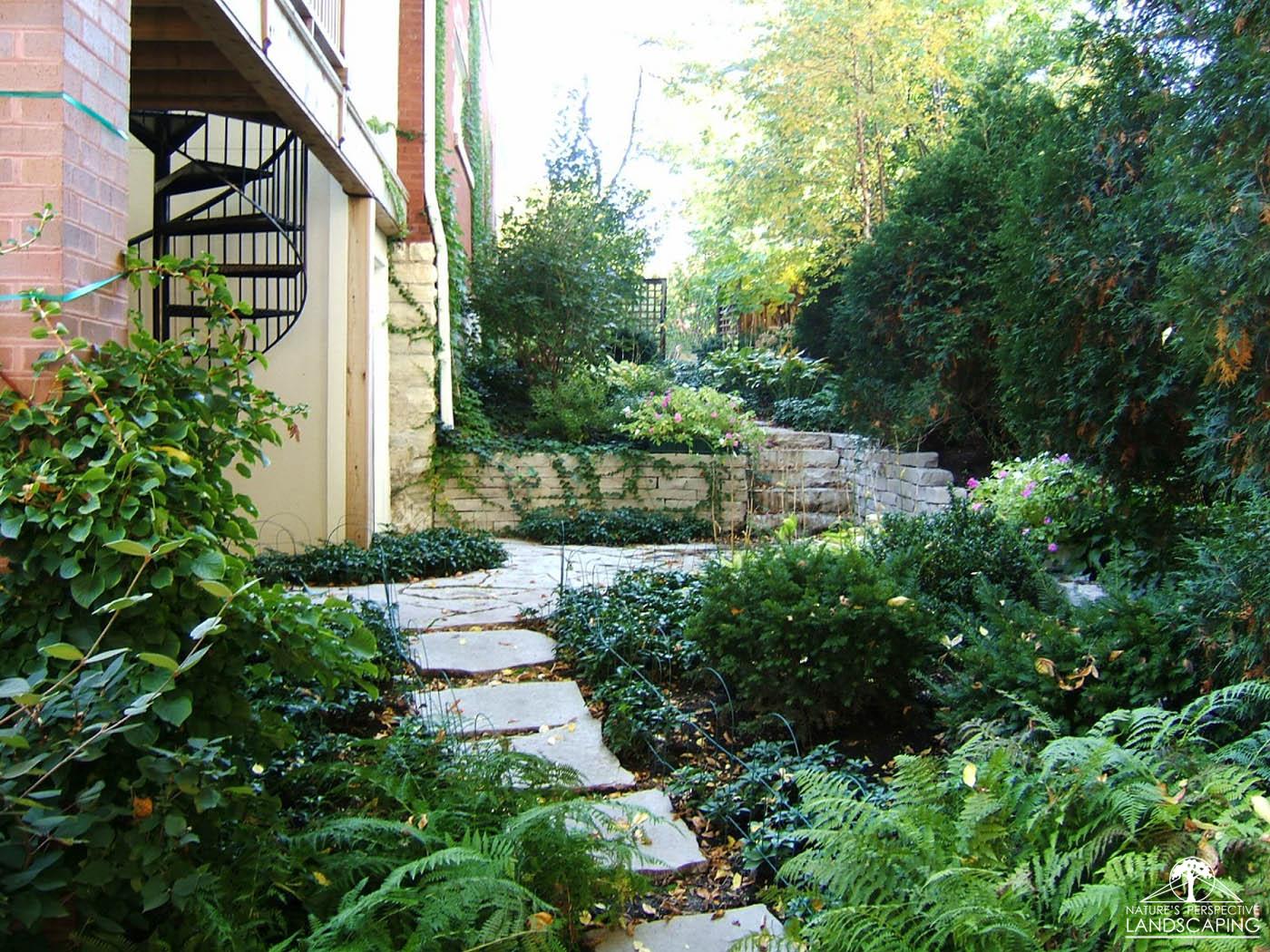 sloped side yard with limestone walks, walls and stepstones-Nature's Perspective Landscaping