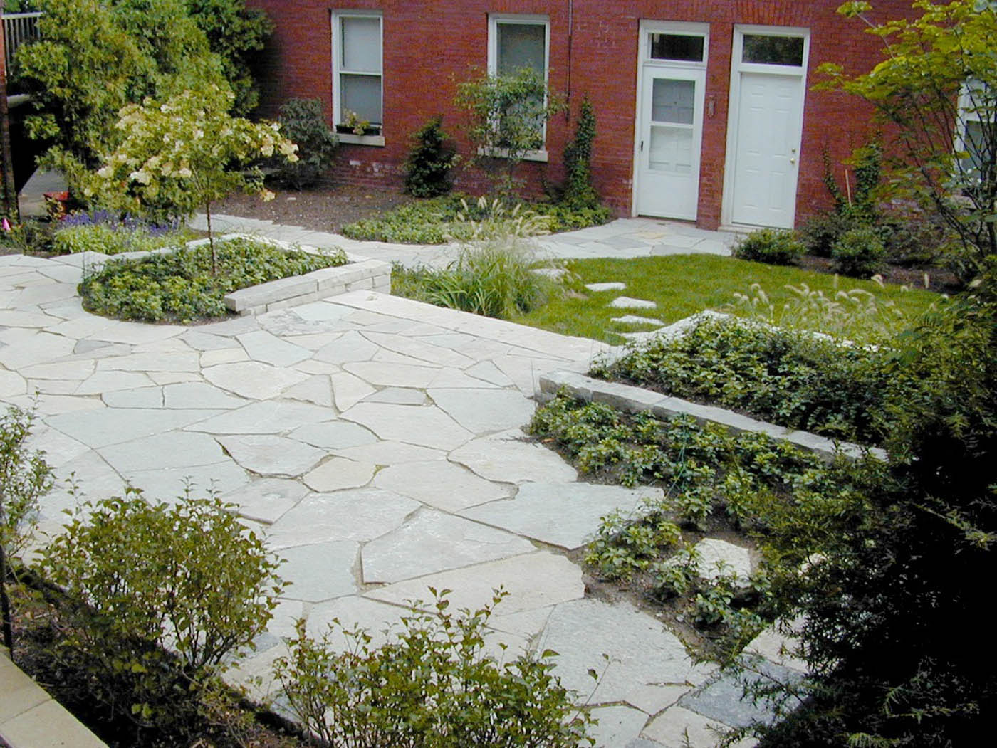 raised limestone paving and walls - Nature's Perspective Landscaping