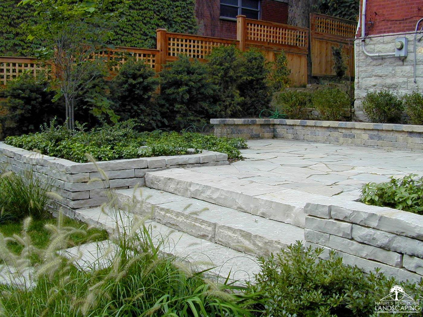 raised limestone terrace and stone steps and walls- Nature's Perspective Landscaping