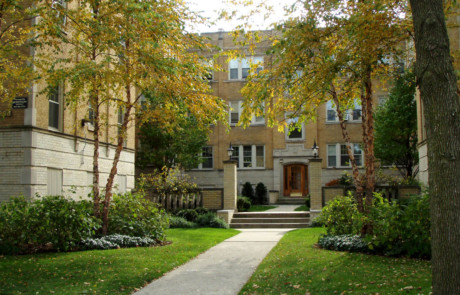 Multi-unit front entrance in fall with river birches