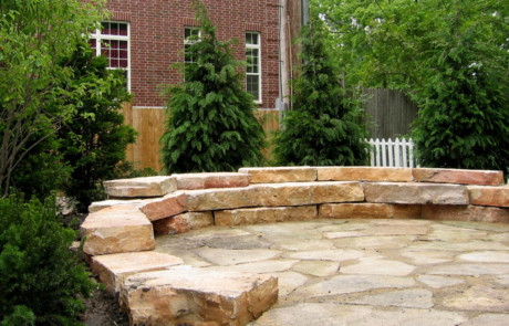 Natural flagstone patio with outcropping seatwall