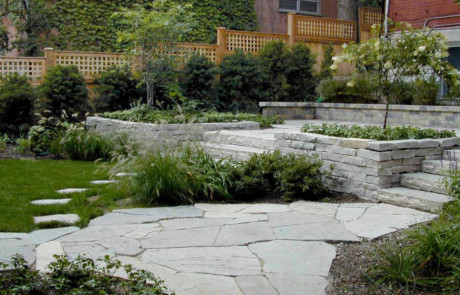 irregular limestone patio, steps, retaining wall, planting