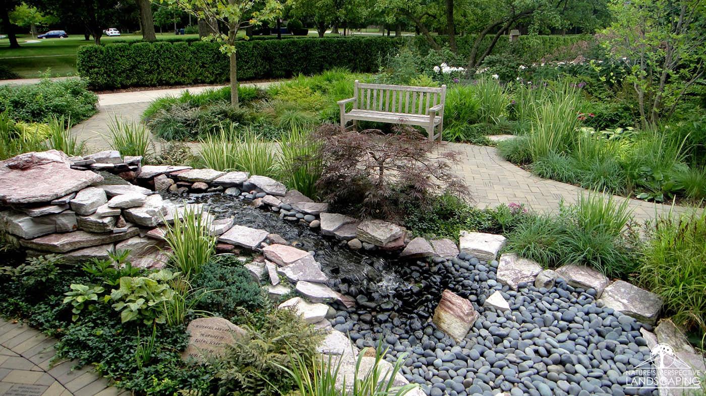 pondless waterfall with plantings and sitting area - Nature's Perspective Landscaping