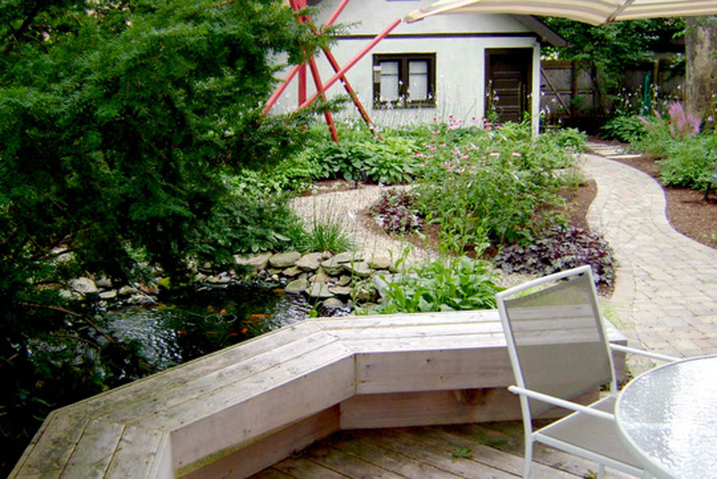 lawn-free shade garden, deck, pond, gravel path- Nature's Perspective Landscaping