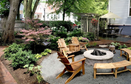 Rustic gravel firepit area with bluestone patio and shade garden