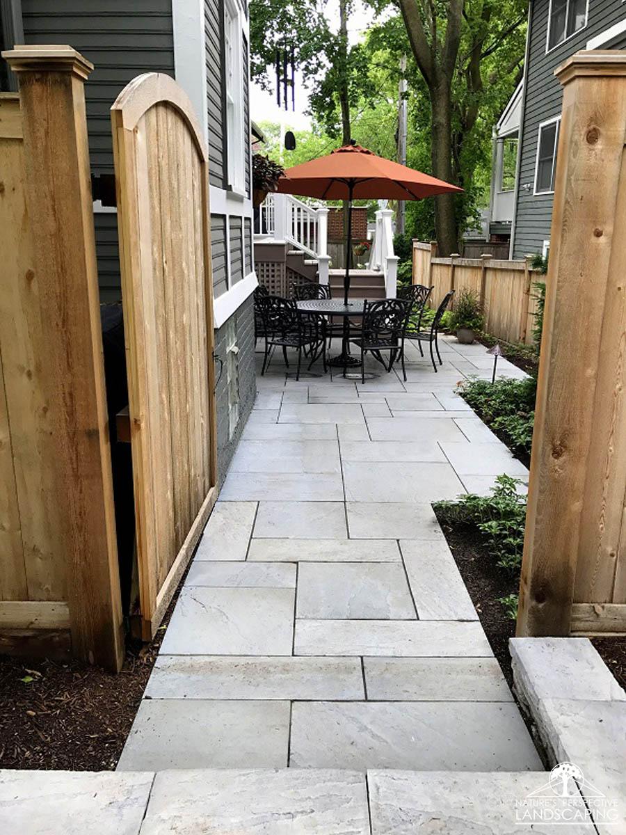 techo-bloc-side-yardfountain-spray-clay-paver-driveway-Nature's Perspective Landscaping