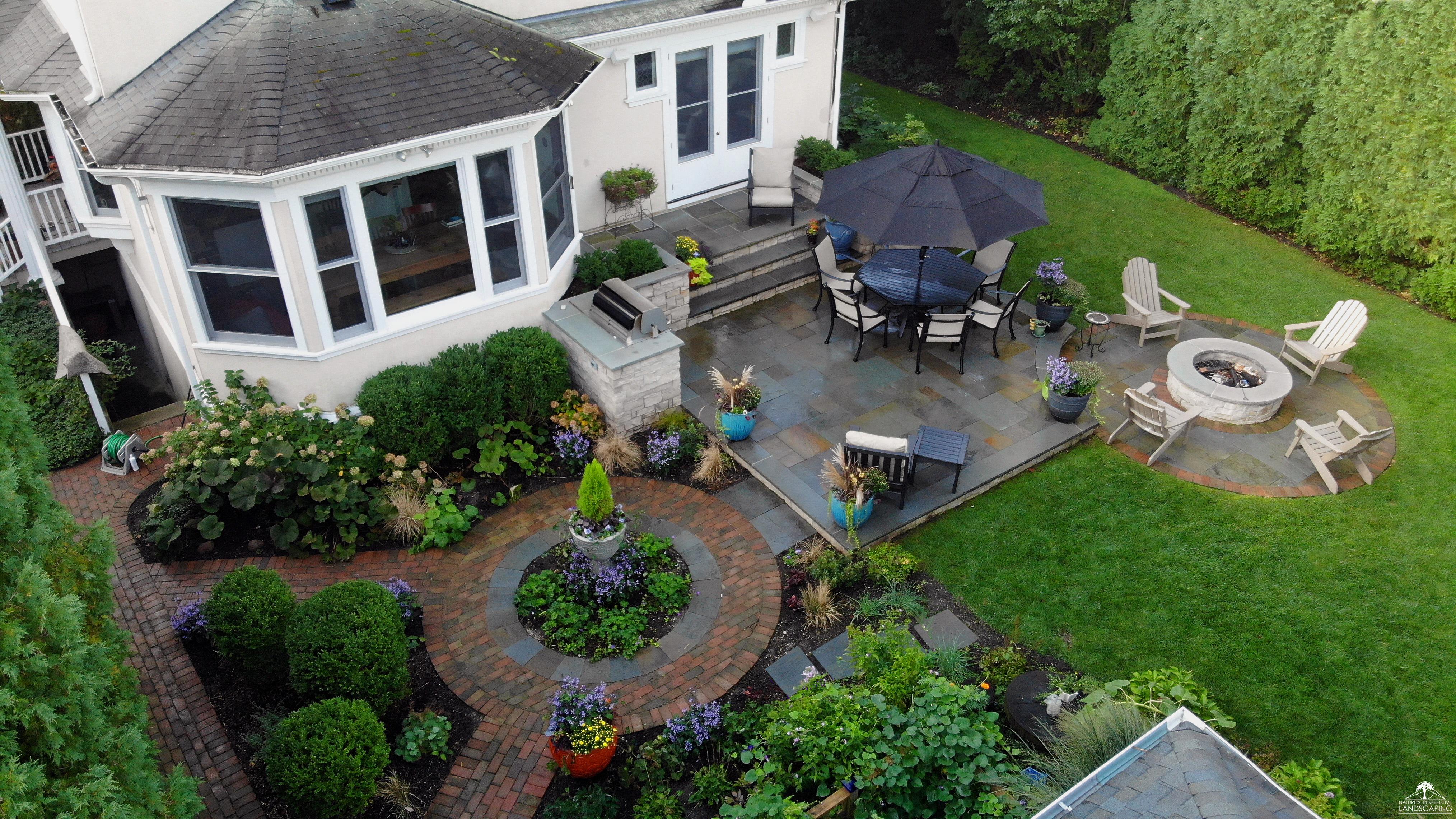 bluestone and clay paver outdoor living area, plantings