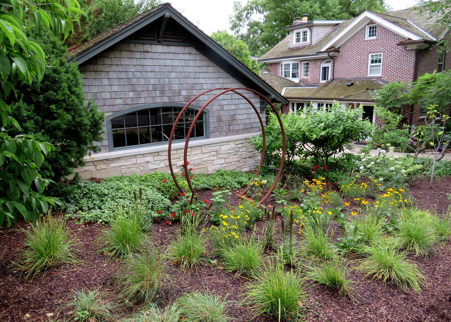 circular trellis with sun-loving perennials