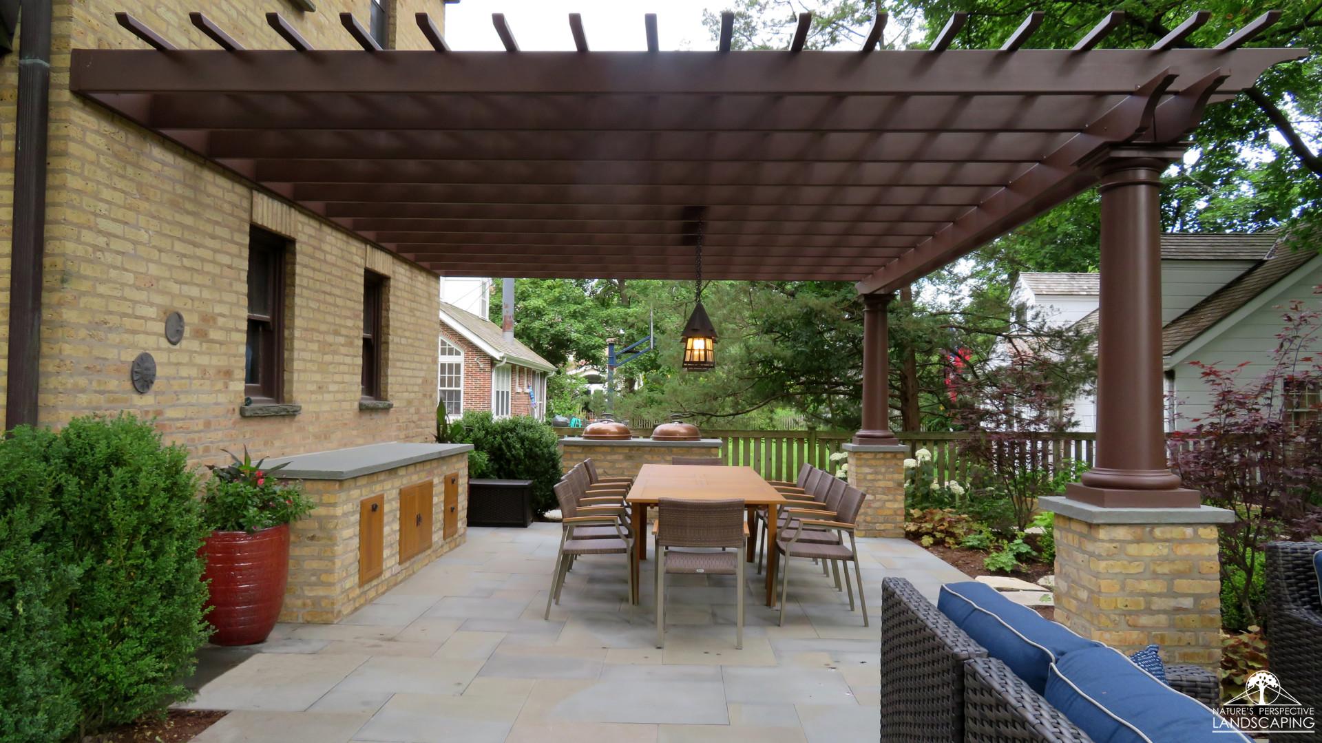 large fiberglass pergola outdoor kitchen and bluestone patio
