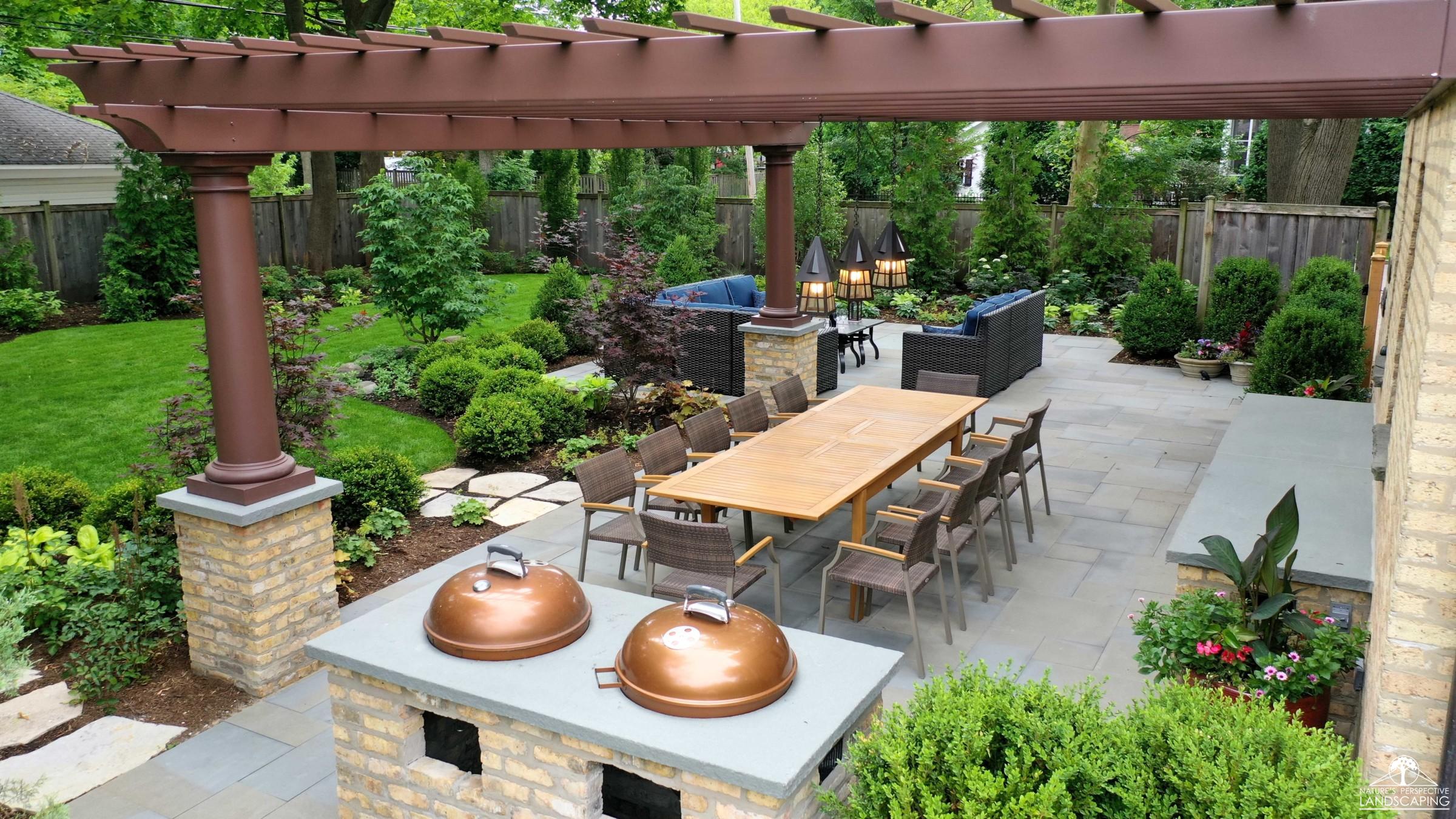 spacious backyard with landscape, fiberglass pergola, bluestone patio and double weber built-in grill
