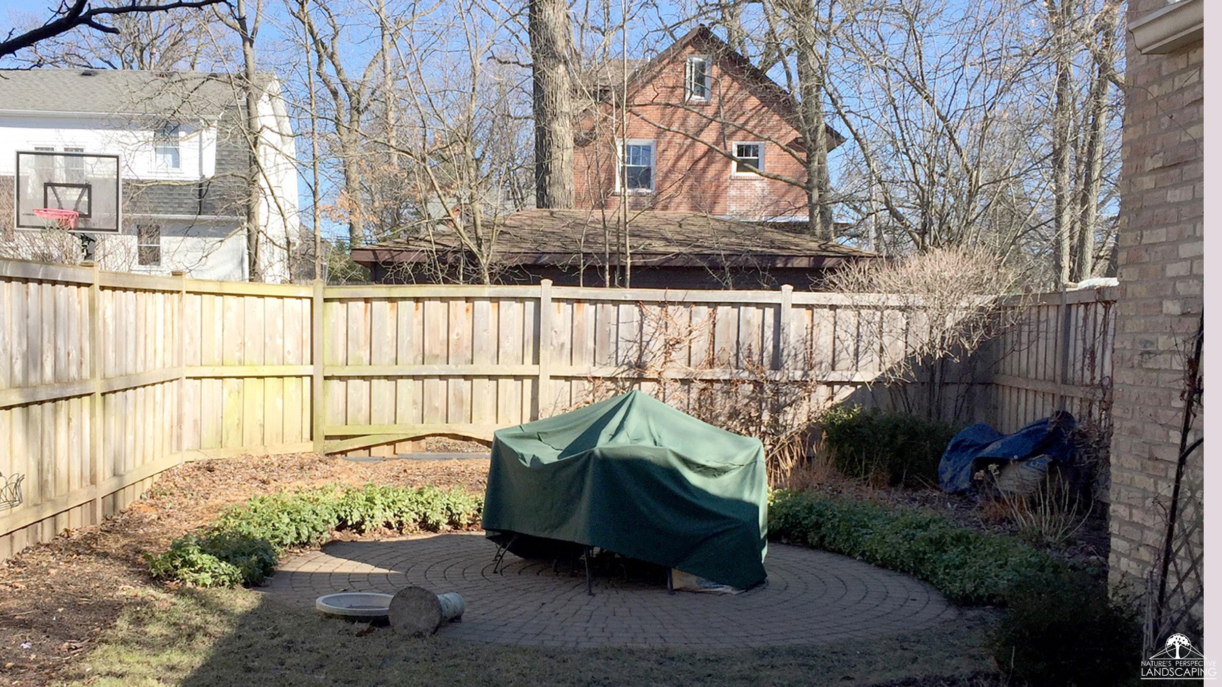 before photo of backyard patio without plantings