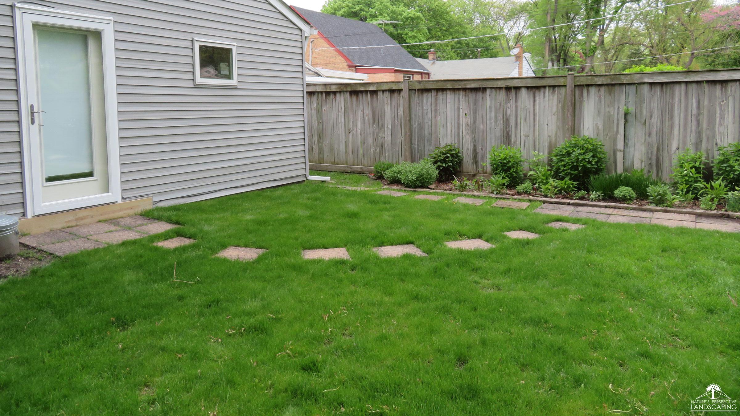 before photo of backyard without hardscaping