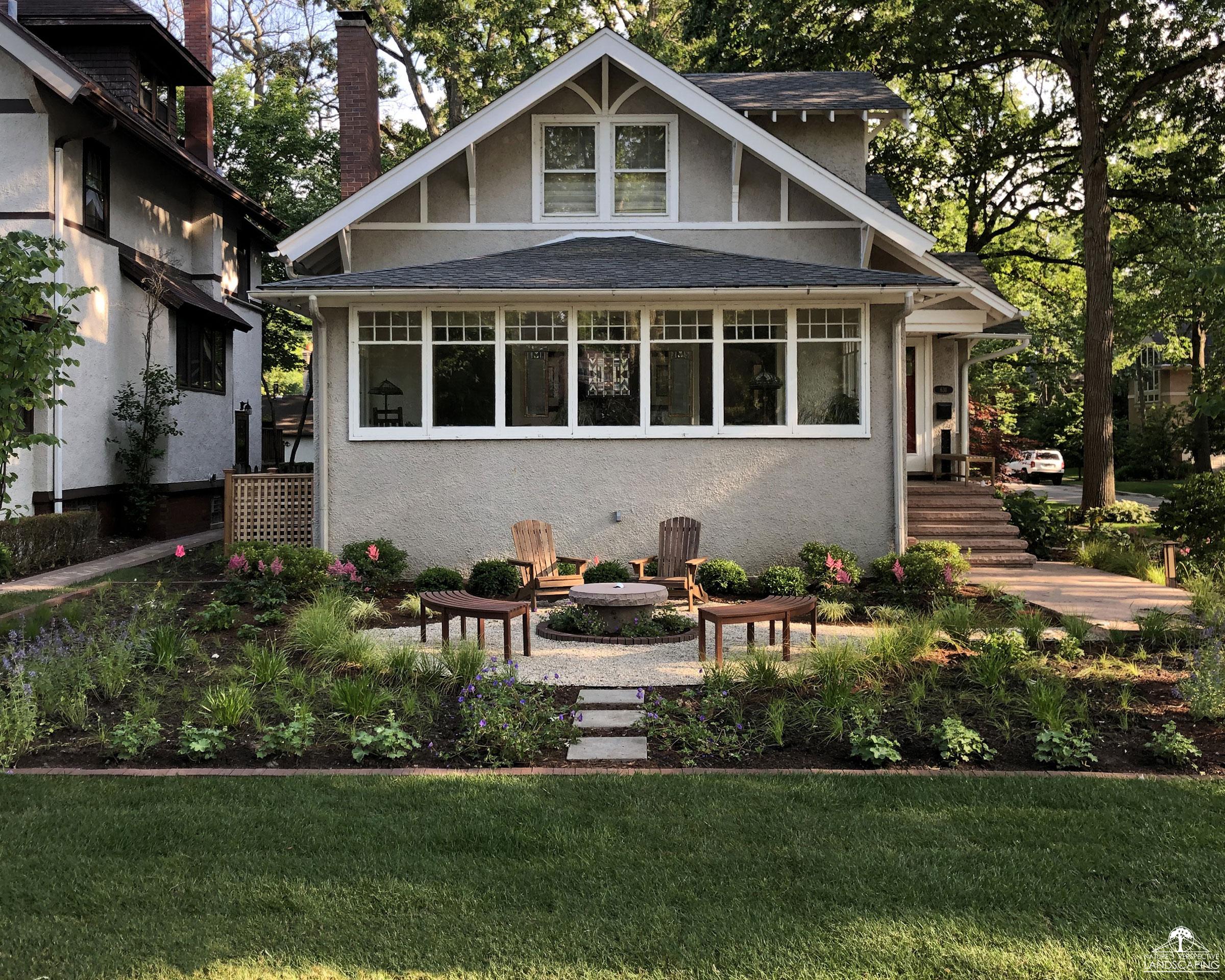 front round gravel sitting area with lush perennials