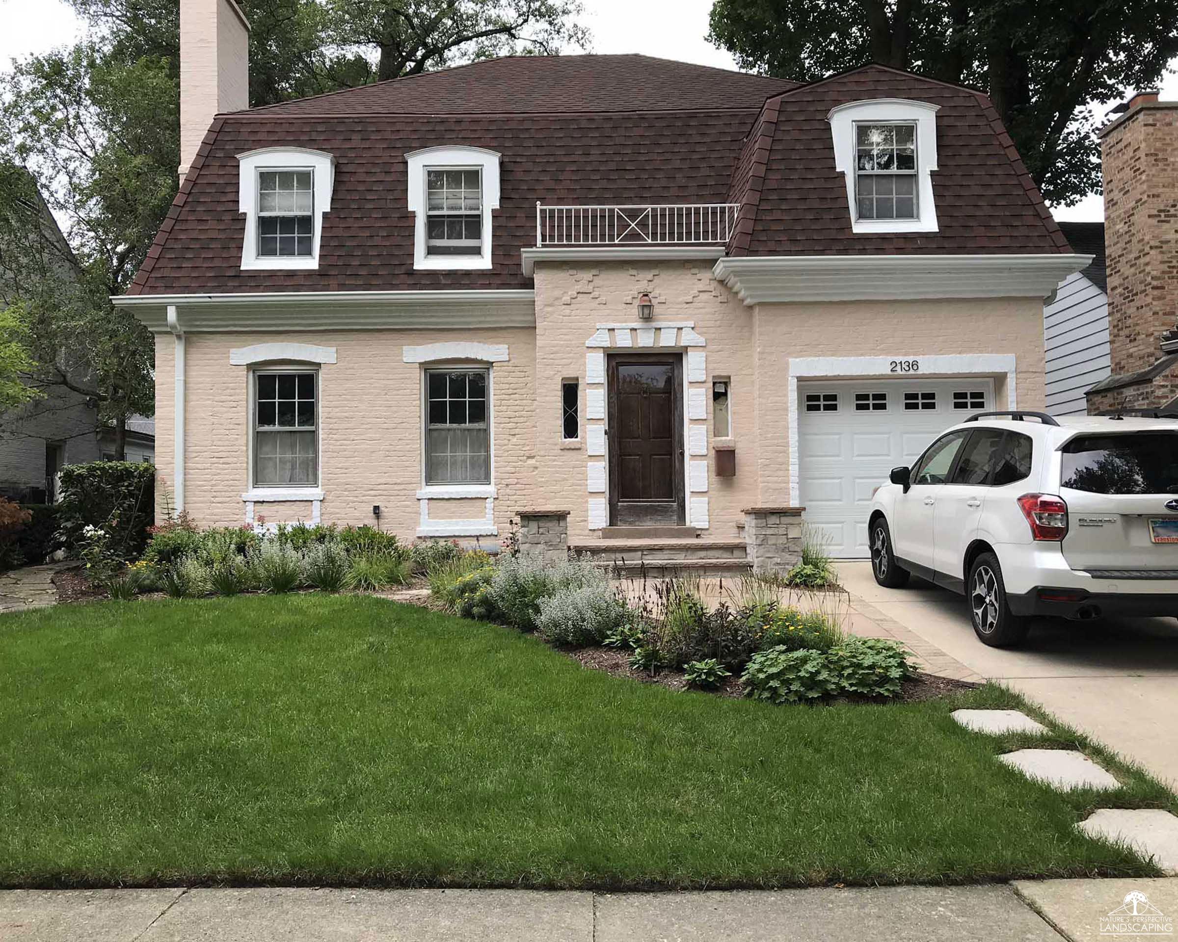 front yard makeover with modular stoop, paver walk and perennials